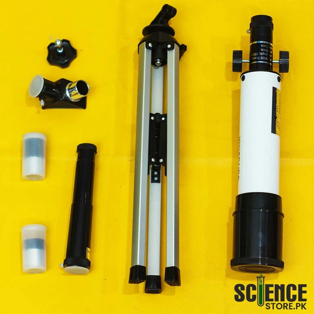 Box contents laid out: optical tube, folded tripod, 45 degree prism, two eyepieces and small fittings.